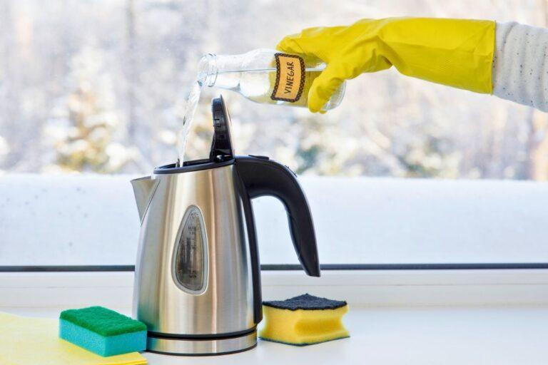 a person is cleaning his kettle with vinegar showing how to descale a kettle
