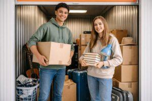 two student - a boy and girl standing in front of a student self storage space