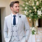 a man wearing a double-breasted suit in a wedding